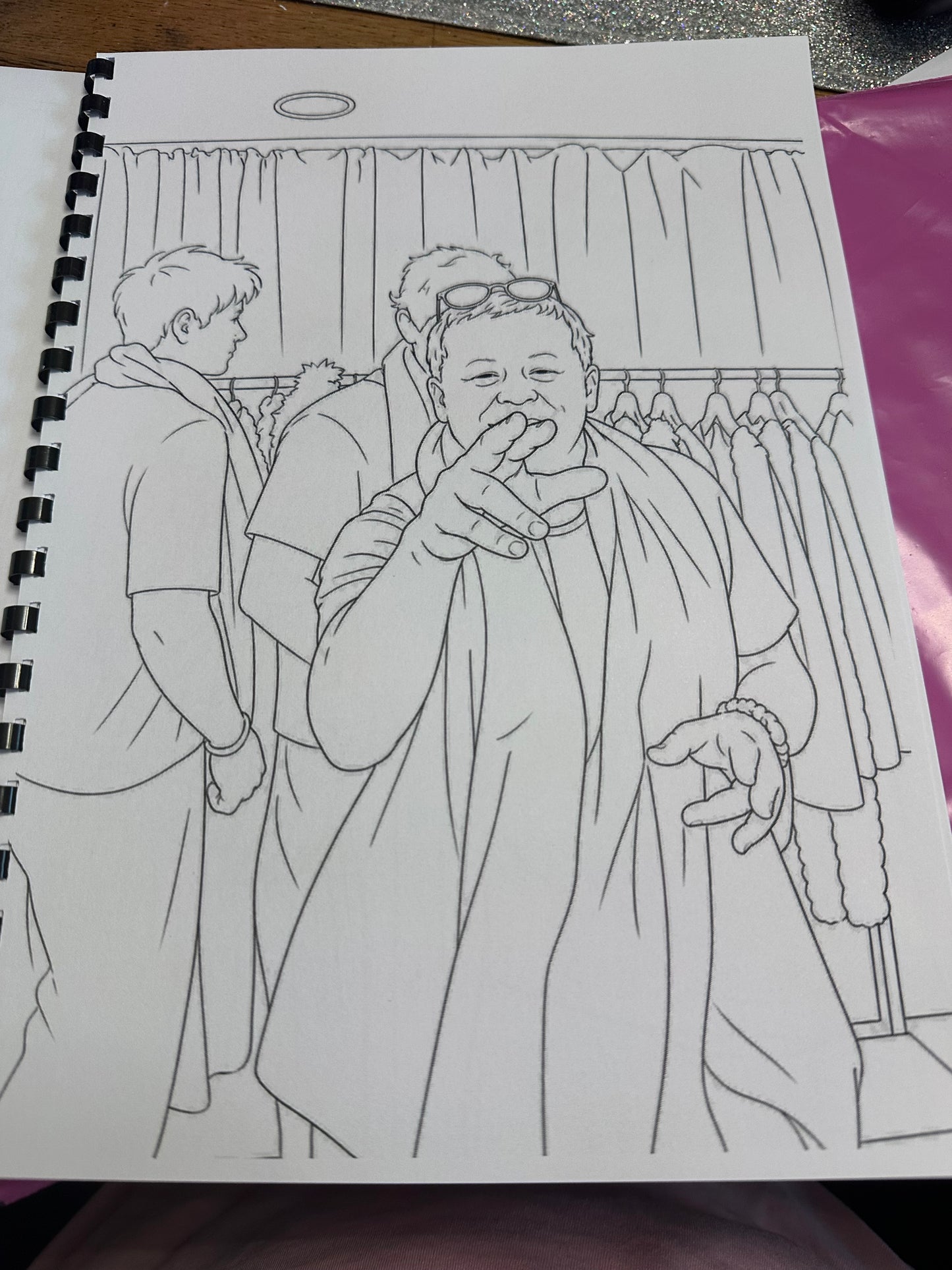 Line drawing of two characters on a piece of paper with a purple background