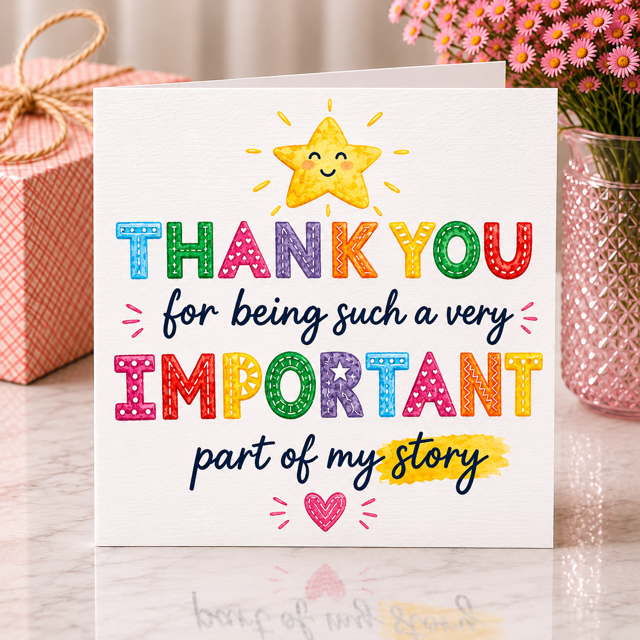 Colorful card with a star illustration and text on a wooden surface with decorative items.