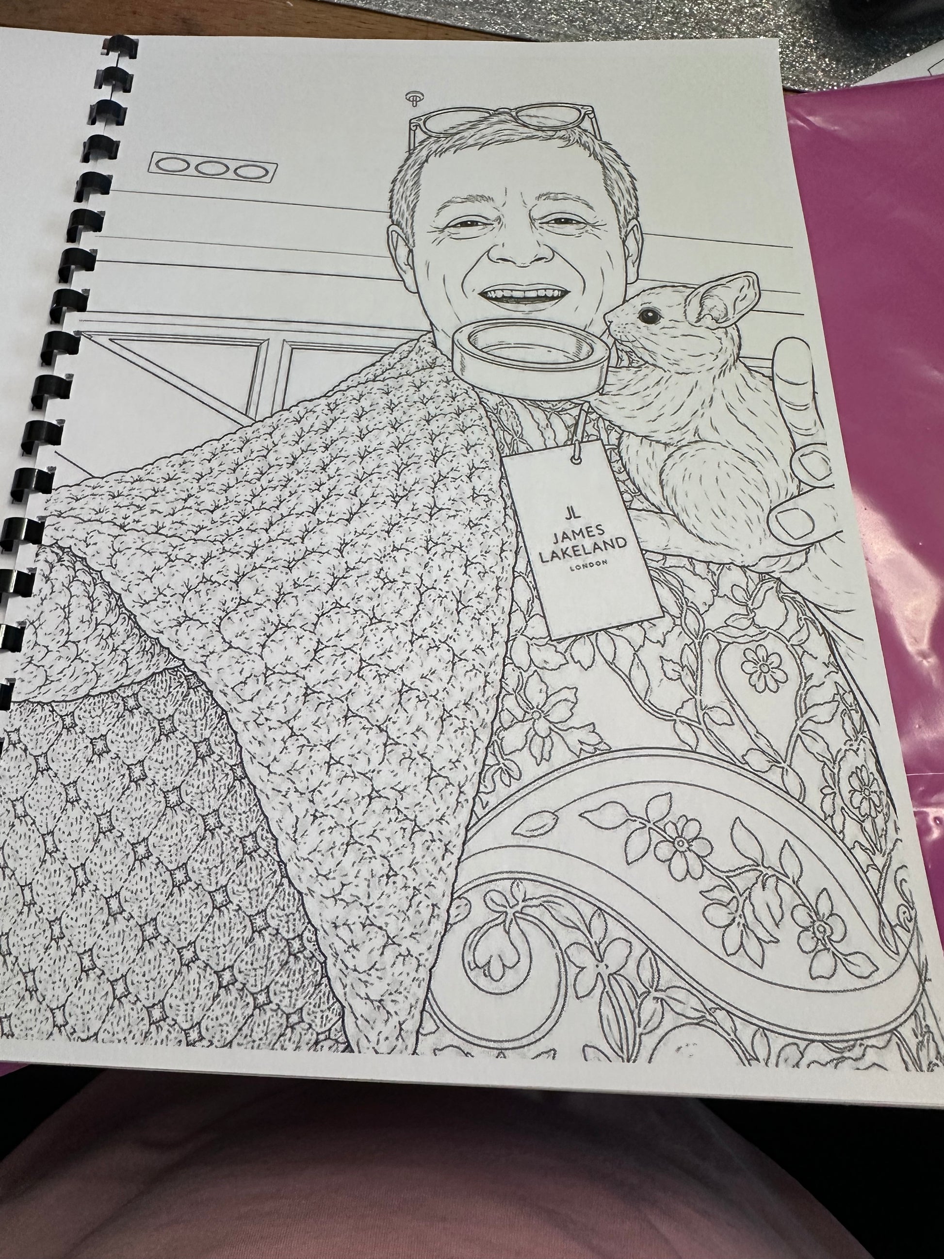 Coloring book page with a detailed illustration of a person and a piggy bank.