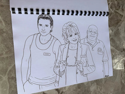Coloring book with black line art of three people on a marble surface