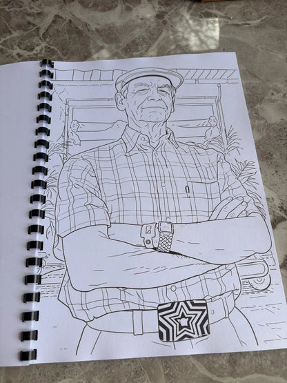 Outline drawing of a person on a spiral-bound notebook with a star design on a textured surface.